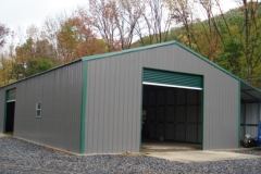 Metal Building Garage Steel Building Grey in Color with Center Roll up Door.
